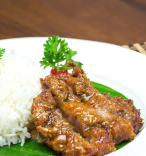 Deep fried pork fillet with fish sauce served with rice